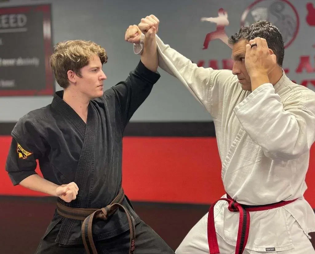Certified instructor demonstrating a technique on the mat at Guido's Martial Arts Academy