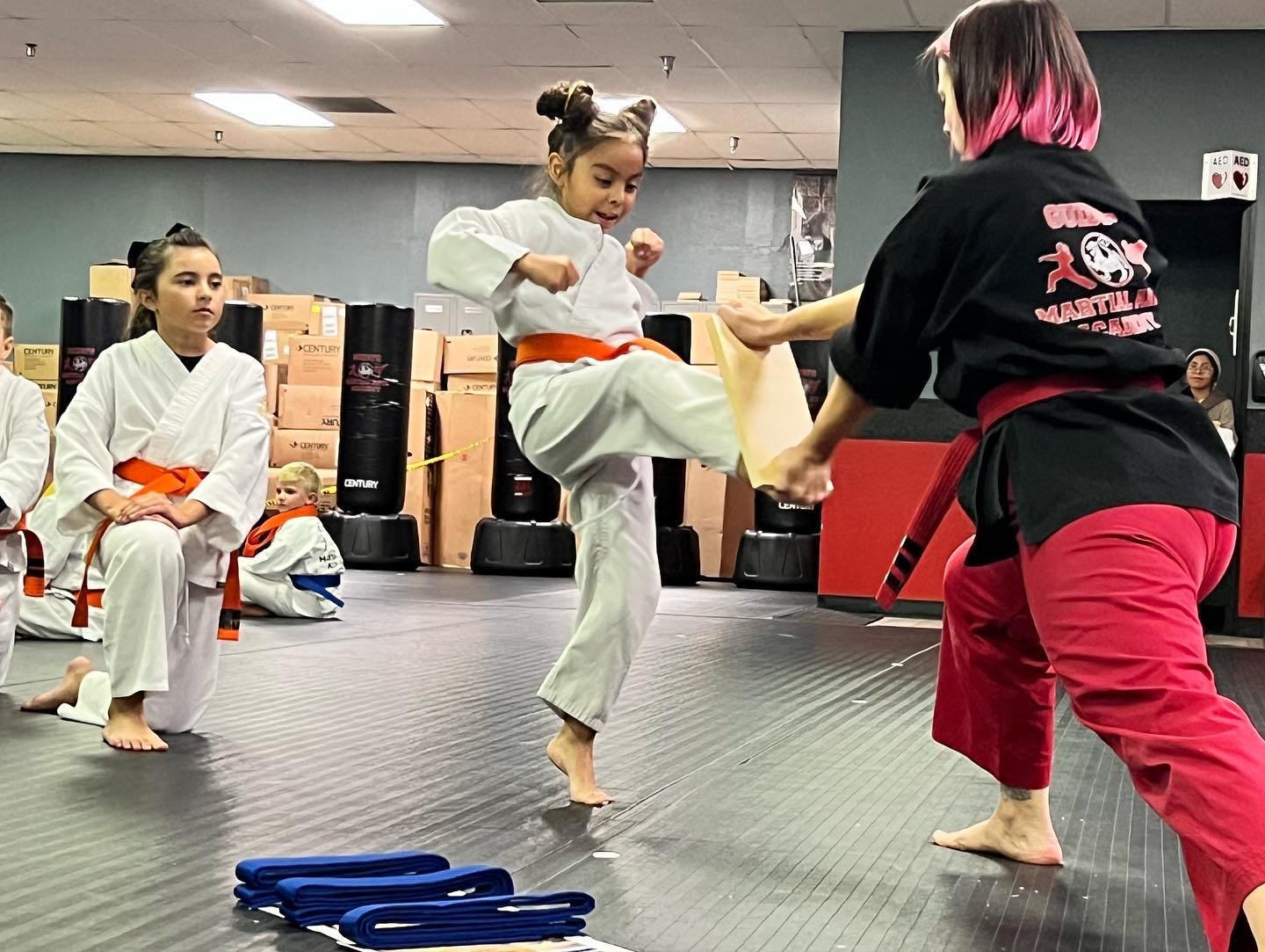 Kids martial arts class at Guido's Martial Arts Academy in Clovis — student executing a kick during drill