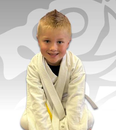 Three and four-year-olds following an instructor in the Little Ninjas class